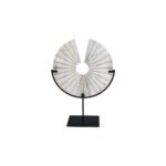 TIBOR Travertine Disc Sculpture featuring a hand-carved circular travertine stone on a sleek black metal base, displayed in a modern living room.