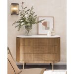 MARIETA White Marble Chest of Drawers featuring natural oak wood frame, gold-tone handles and legs, and an oval white marble top.