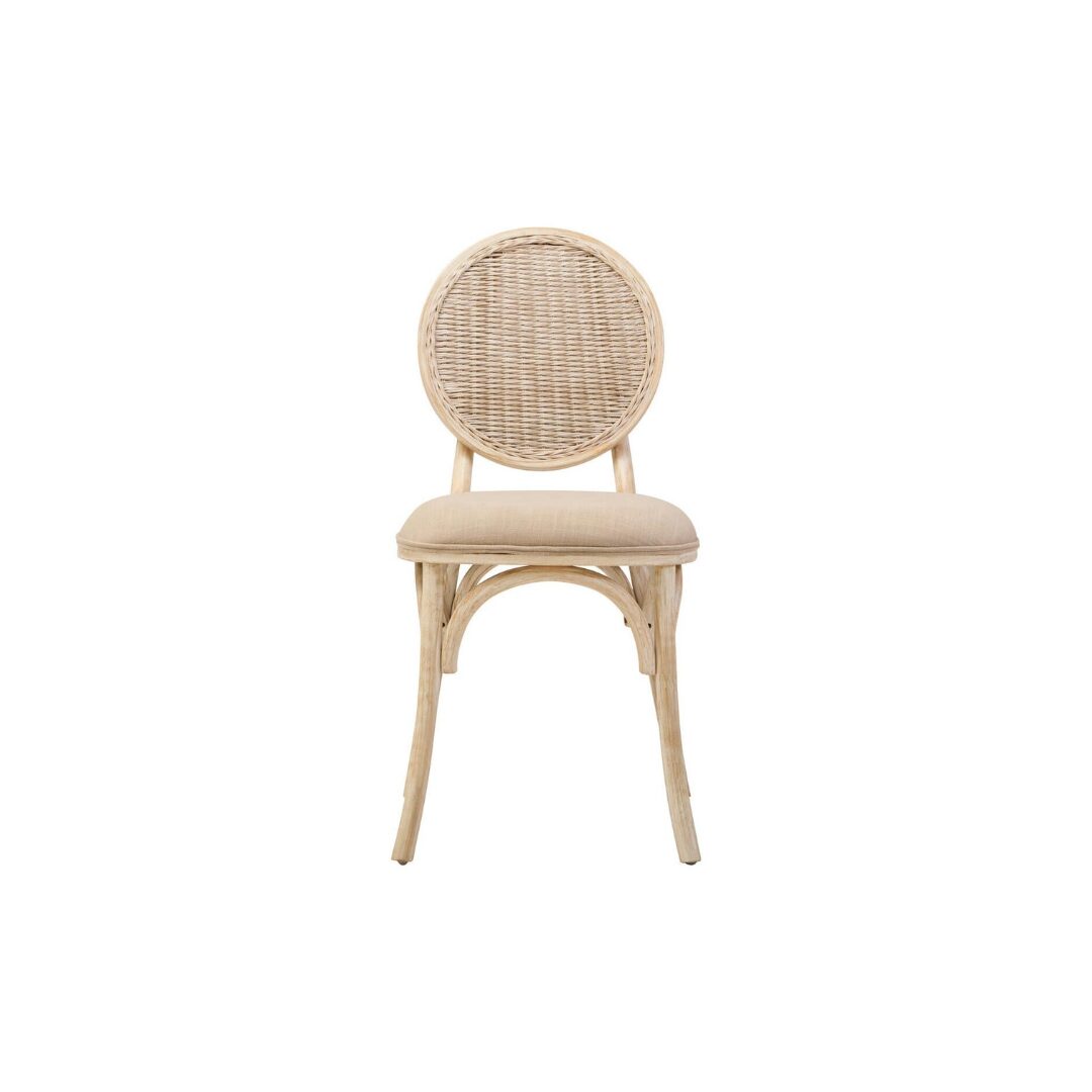 WALTON White Wash Elm Wood Dining Chair featuring cane woven backrest and beige cushioned seat styled in a bright modern dining room.