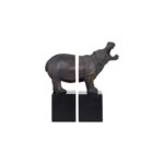 NORIA Set of 2 Hippo Bookends in bronze finish on black bases displayed on a modern bookshelf.