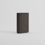 NOEL Ash and Marble Chest of Drawers featuring dark ash wood body with matte dark grey marble top in a modern bedroom setting.