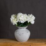 DARCY Antique White Vase – Handcrafted ceramic vase with antique white stone finish, ideal for floral arrangements or standalone décor in modern and traditional spaces.