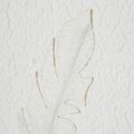 SOLLI White Feathers Art in champagne-beaded frame with raised feather impressions for contemporary and coastal interiors.
