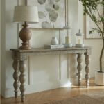 Rutland Collection wooden console table with refined architectural design in warm brown finish.