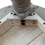 Rutland Collection round wooden coffee table in modern brown finish.