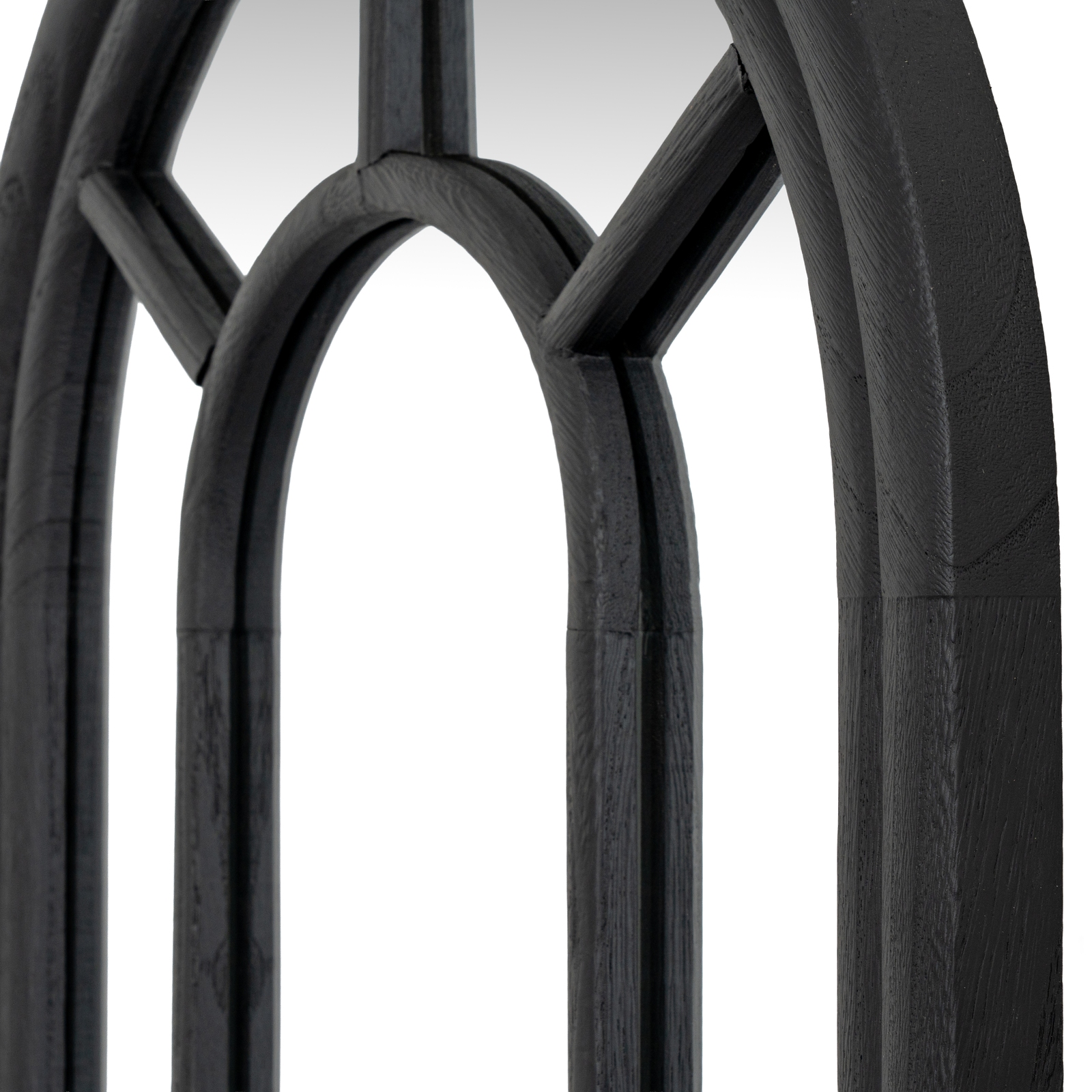 Tall black arched window-style mirror with timber frame