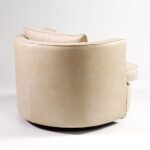 JULES Off-White Armchair – modern leather armchair with semi-circular backrest and black metal frame, designed for stylish comfort.