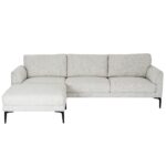 White three-seater sofa with textured fabric upholstery, matching footstool, and slim black metal legs.