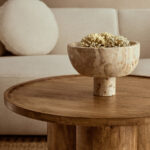 Chocolate marble pedestal bowl with natural veining and a round elevated base.