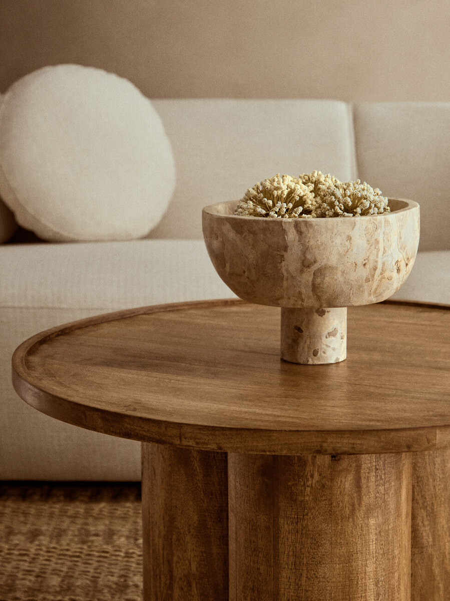 Chocolate marble pedestal bowl with natural veining and a round elevated base.