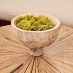 Chocolate marble pedestal bowl with natural veining and a round elevated base.