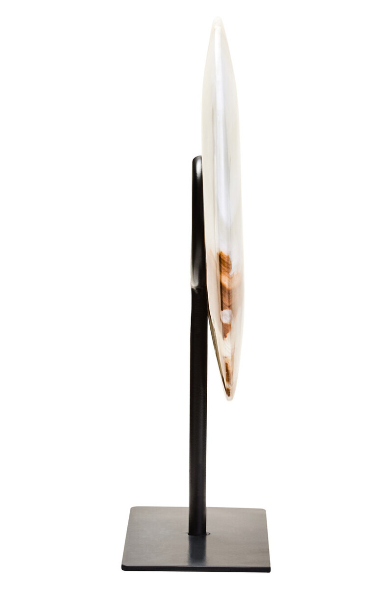 Polished round onyx disc in natural earthy tones displayed on a black metal stand.