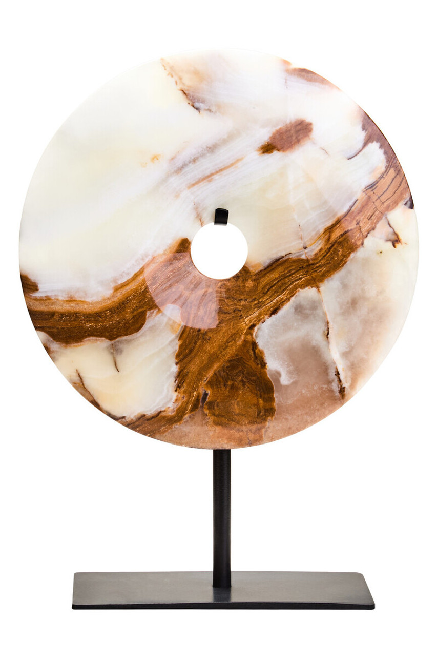 Polished round onyx disc in natural earthy tones displayed on a black metal stand.