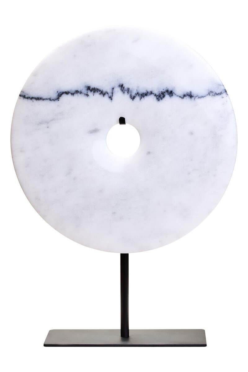 The ZORO Medium White Marble Disc Sculpture features a polished white marble disc with natural veining mounted on a sleek black metal stand, offering a refined and minimalist decorative accent.
