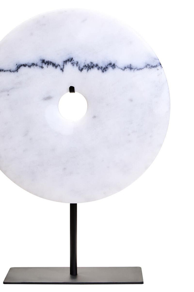 The ZORO Medium White Marble Disc Sculpture features a polished white marble disc with natural veining mounted on a sleek black metal stand, offering a refined and minimalist decorative accent.