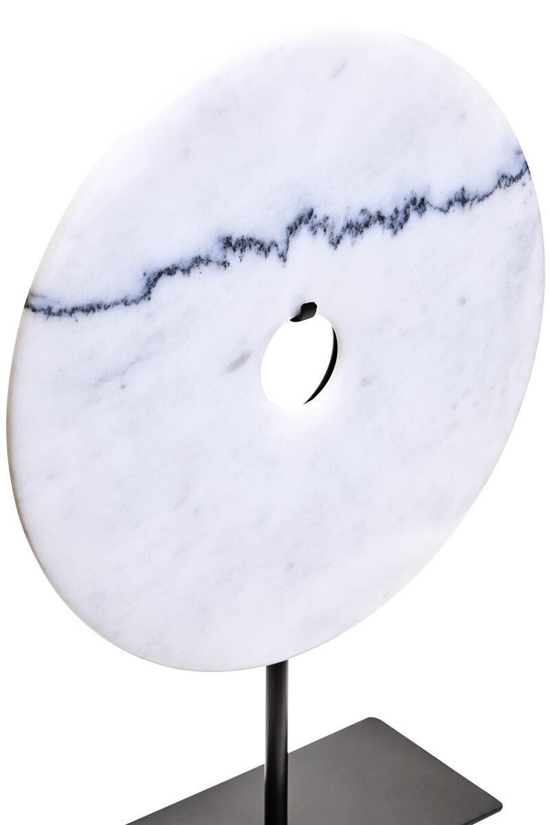 The ZORO Medium White Marble Disc Sculpture features a polished white marble disc with natural veining mounted on a sleek black metal stand, offering a refined and minimalist decorative accent.