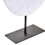 The ZORO Medium White Marble Disc Sculpture features a polished white marble disc with natural veining mounted on a sleek black metal stand, offering a refined and minimalist decorative accent.