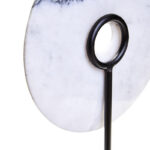 The ZORO Medium White Marble Disc Sculpture features a polished white marble disc with natural veining mounted on a sleek black metal stand, offering a refined and minimalist decorative accent.