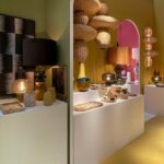 Handcrafted bronze and yellow glazed ceramic table lamp with stacked sculptural base and dark drum shade