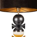 Handcrafted bronze and yellow glazed ceramic table lamp with stacked sculptural base and dark drum shade