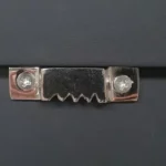 White textured wall art with vertical ribbed detailing and a semi-circular relief in a wooden frame.