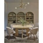 MIKAEL beige travertine marble dining table with round top and sculptural stone legs