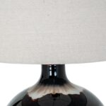 SEPIA table lamp with brown sepia-toned glass base and natural linen shade, providing warm ambient lighting for modern interiors.