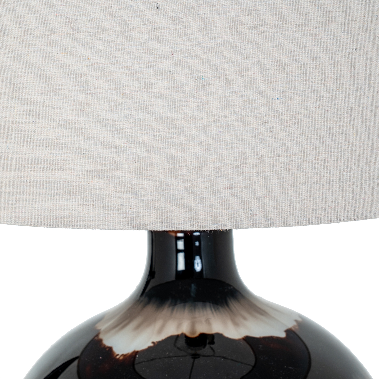 SEPIA table lamp with brown sepia-toned glass base and natural linen shade, providing warm ambient lighting for modern interiors.