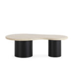 Harvey coffee table with cream travertine top and black cylindrical ash veneer legs in modern living room setting.