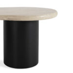 Harvey coffee table with cream travertine top and black cylindrical ash veneer legs in modern living room setting.