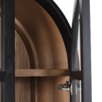James ashwood display cabinet with black frame, walnut interior and glass doors in tall arched design.