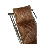 Brown genuine leather quilted chair with iron frame and curved wooden armrests, designed for industrial-style modern interior seating.