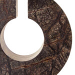 Abstract forest green marble sculpture with circular cut-out and cylindrical base, designed as a luxury decorative accent for modern interiors.