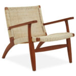Natural rattan woven accent chair with solid mahogany wood frame, armrests, and mid-century boho styling for modern interior seating.