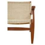 Natural rattan woven accent chair with solid mahogany wood frame, armrests, and mid-century boho styling for modern interior seating.