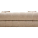 Cream linen curved three seater sofa with channel tufted detailing and rounded back design for modern luxury living room seating.
