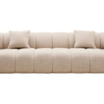 Cream linen curved three seater sofa with channel tufted detailing and rounded back design for modern luxury living room seating.