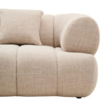 Cream linen curved three seater sofa with channel tufted detailing and rounded back design for modern luxury living room seating.