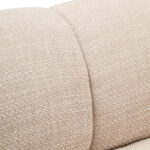 Cream linen curved three seater sofa with channel tufted detailing and rounded back design for modern luxury living room seating.