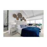 White and greyish oak finish bedside table with slatted drawer front and open lower shelf, designed for elegant modern bedroom storage.