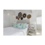 White and greyish oak finish bedside table with slatted drawer front and open lower shelf, designed for elegant modern bedroom storage.