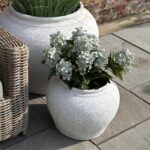Set of two matte white ceramic planters with minimalist Mediterranean design, ideal for indoor and outdoor greenery styling.