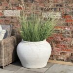Set of two matte white ceramic planters with minimalist Mediterranean design, ideal for indoor and outdoor greenery styling.