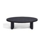 Large oval black brown oak coffee table with sculptural end legs and contemporary open tabletop detail, designed for luxury modern living spaces.